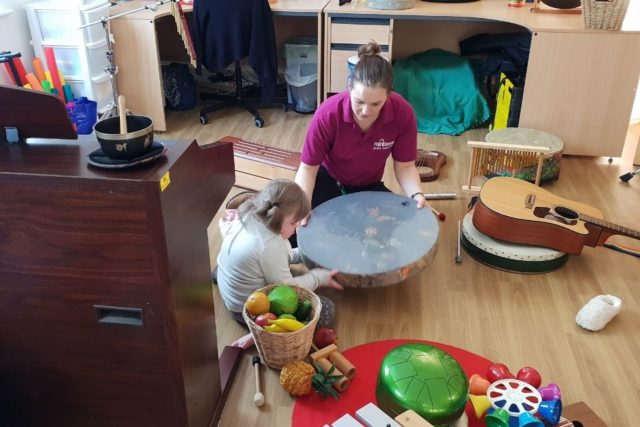 A child having music therapy at Rainbows