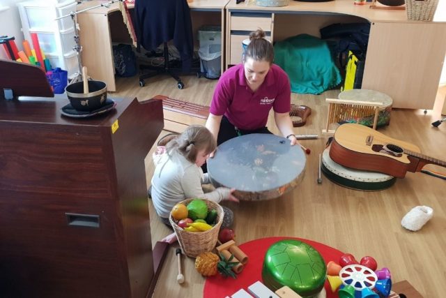 A child having music therapy at Rainbows