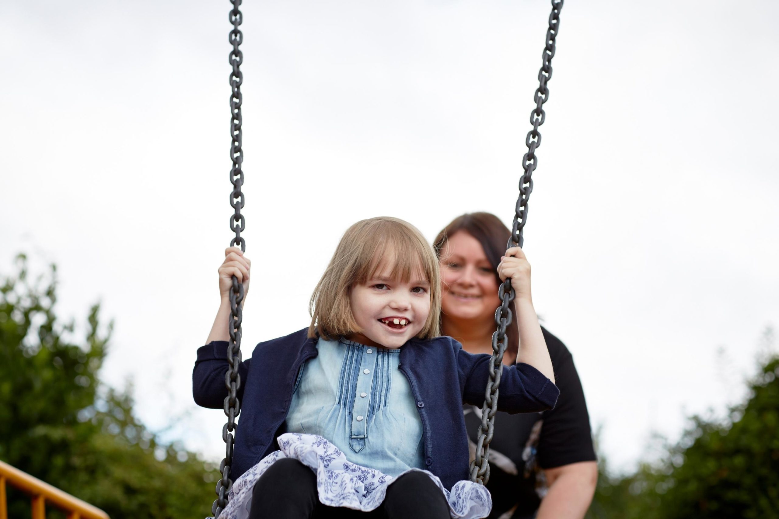 A young girl on a swing