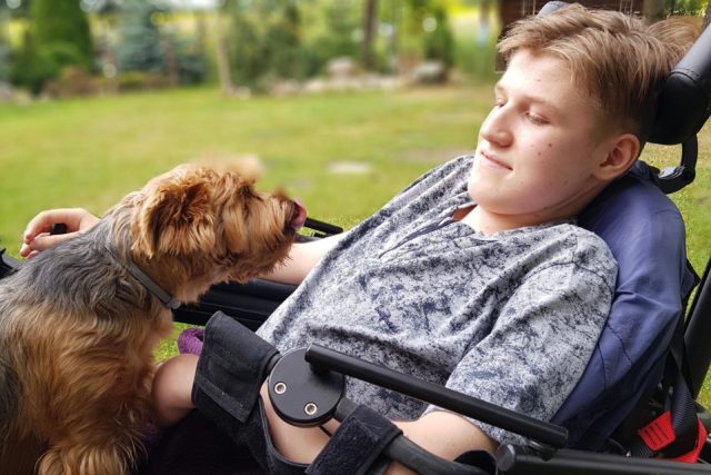 A young boy with his dog