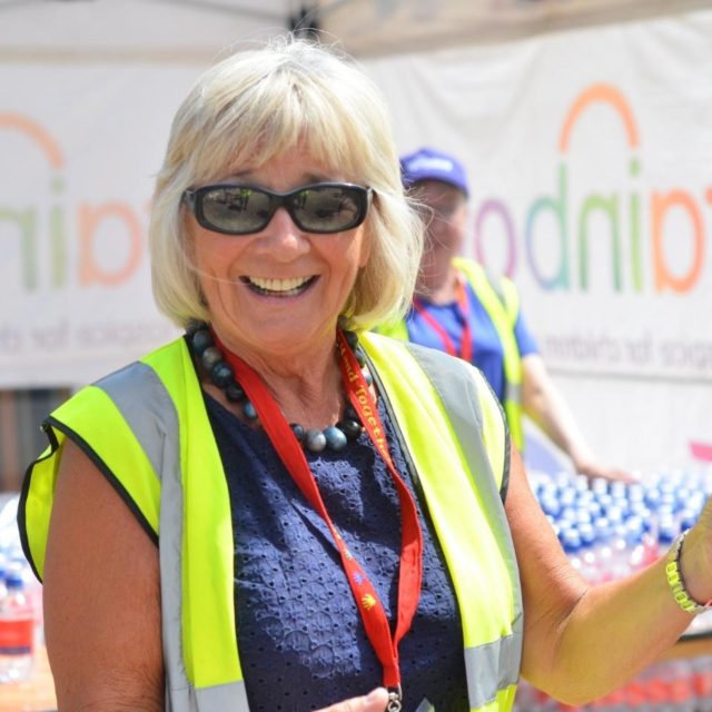 A smiling female volunteer